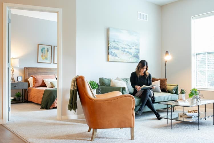 Cincinnati apartments for rent - image - Residents Lounging in the Living Area | Cincinnati OH Apartments | The residences at MQ