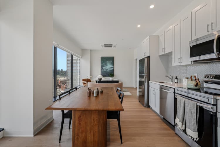 Cincinnati apartments for rent - image - A modern kitchen with a wooden island and stainless steel appliances.