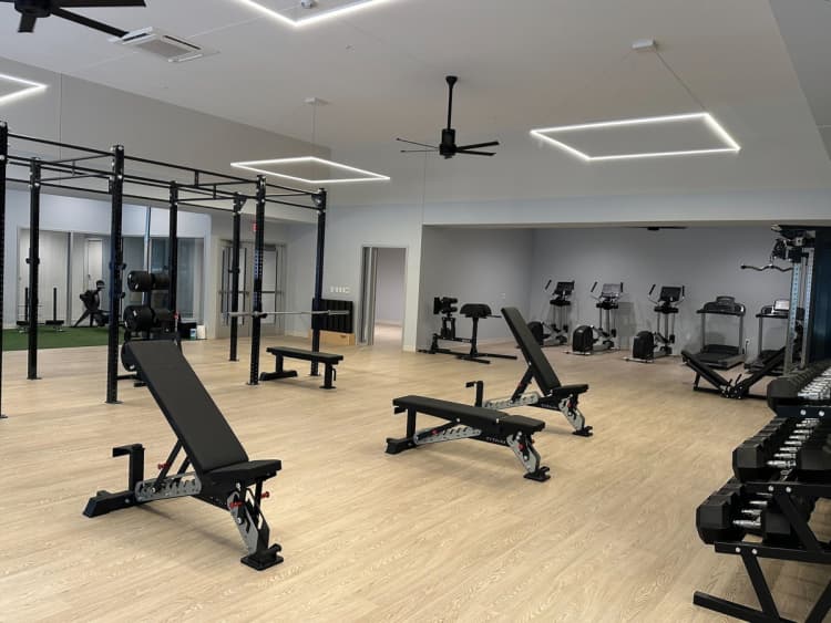 Cincinnati apartments for rent - image - A gym with a variety of equipment including benches and weight racks