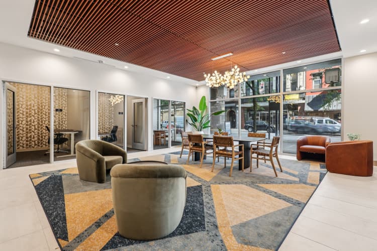 Cincinnati apartments for rent - image - A modern living room with a wooden ceiling and a large rug.