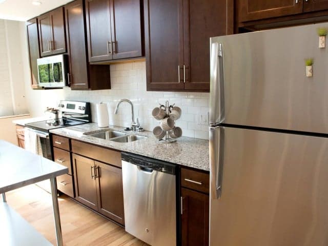 Cincinnati apartments for rent - image - Kitchen with espresso cabinets and stainless appliances