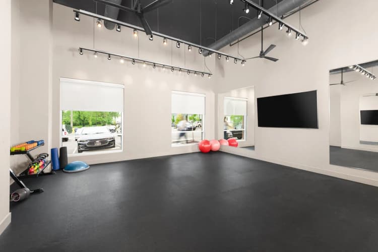 Cincinnati apartments for rent - image - Altura Apartments spacious yoga studio equipped with a television screen for instruction or entertainment.