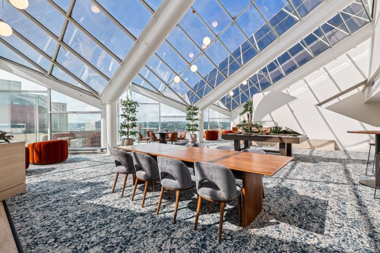 undefined apartments for rent - image - A conference room with a long table and chairs.