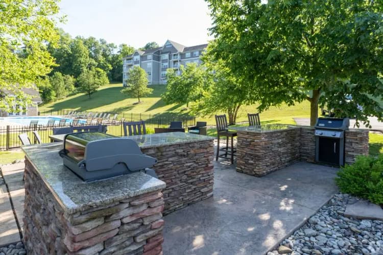 undefined apartments for rent - image - wb-gallery-outdoor-stone-grilling-patio-with-pool.jpg