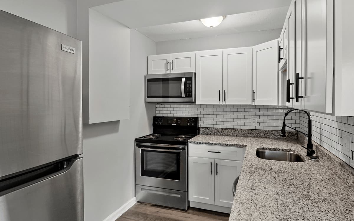 undefined apartments for rent - image - Experience culinary bliss in this sleek, modern kitchen designed for efficiency and style.